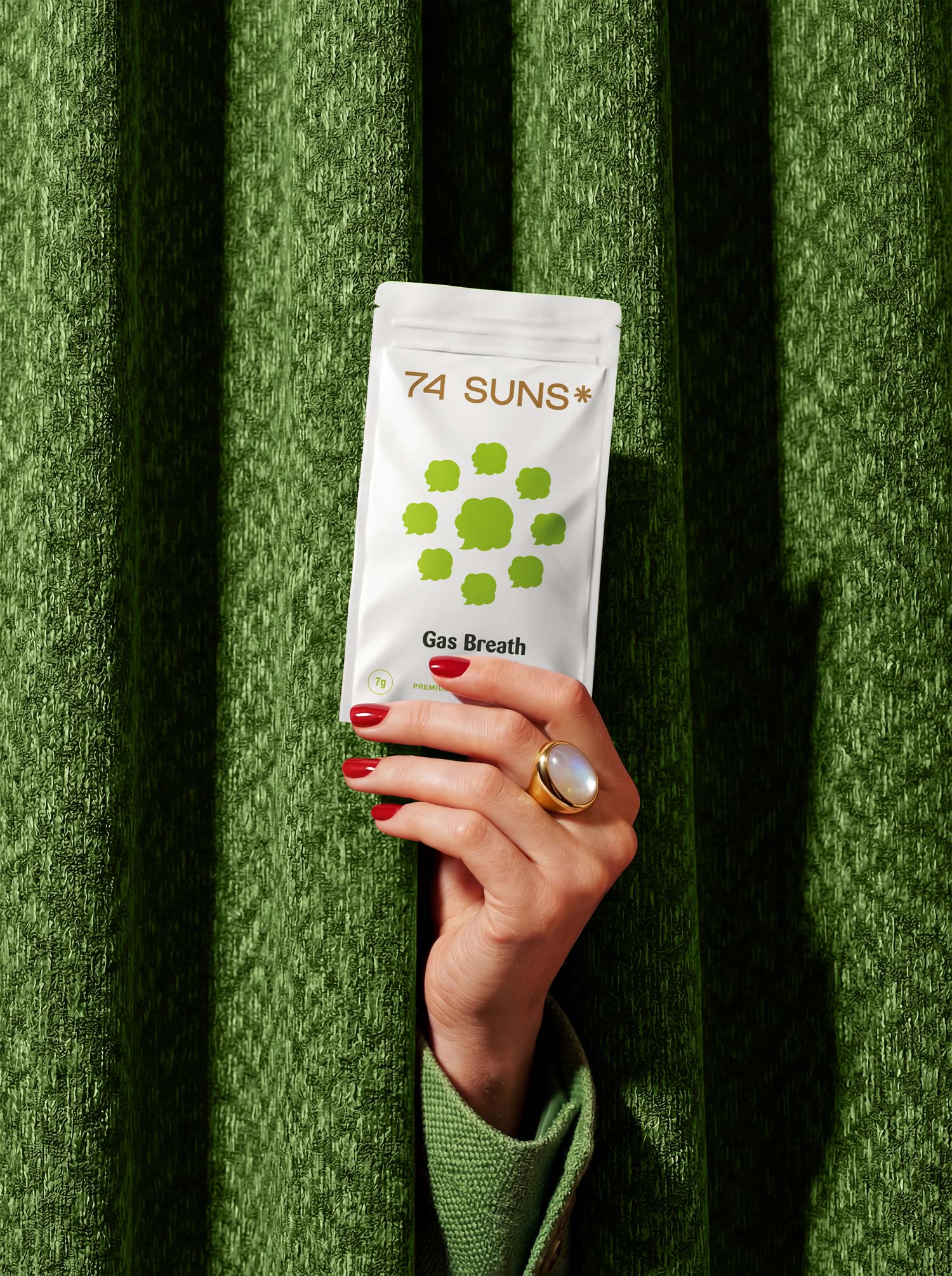 74 SUNS Lifestyle Photography hand holding Cannabis Package Design